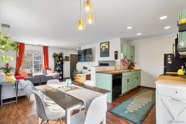 a large kitchen with a table and chairs in it