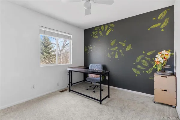 a view of a workspace with furniture