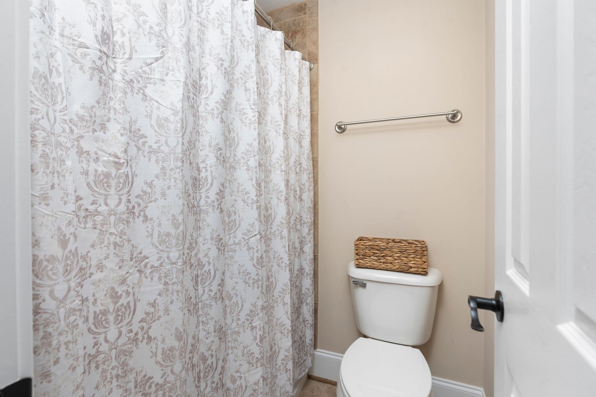 114 Jaspers Lane Stuarts Draft, VA 24477 - Photo 29 of 41 a white toilet sitting next to a shower curtain