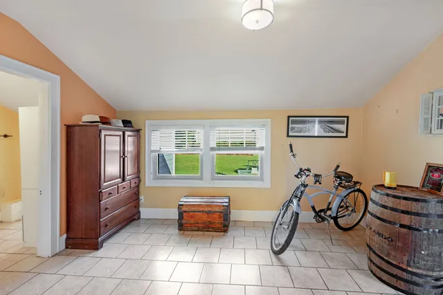 a garage with a couch and a large window