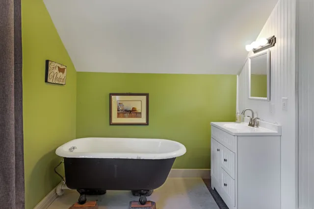 a room with a sink and a mirror