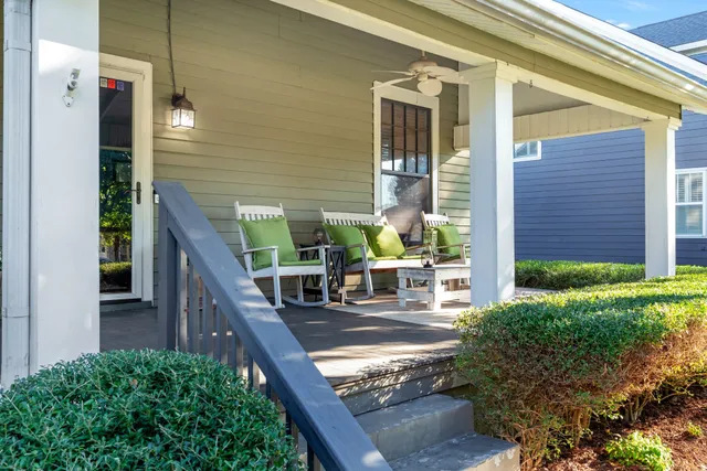 a view of house with outdoor seating and stairs
