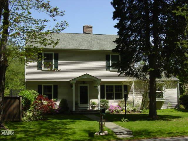 23 Irvine Road Greenwich, CT 06870 - Photo 1 of 1 a front view of a house with garden