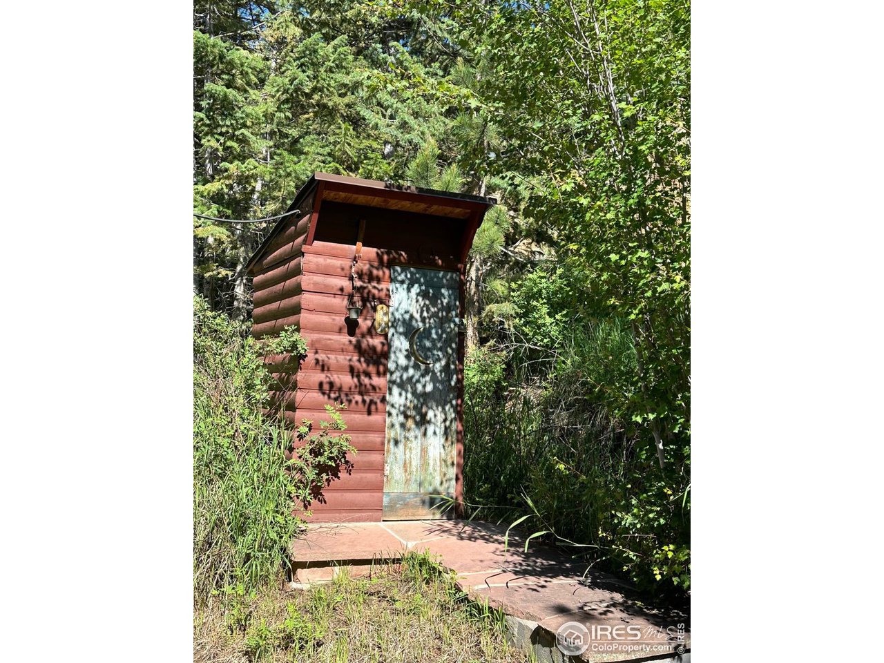 414 Riverside Drive Lyons, CO 80540 - Photo 11 of 23 a pathway of a house with a yard