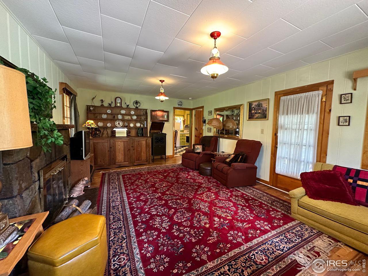 414 Riverside Drive Lyons, CO 80540 - Photo 15 of 23 a living room with furniture rug and window