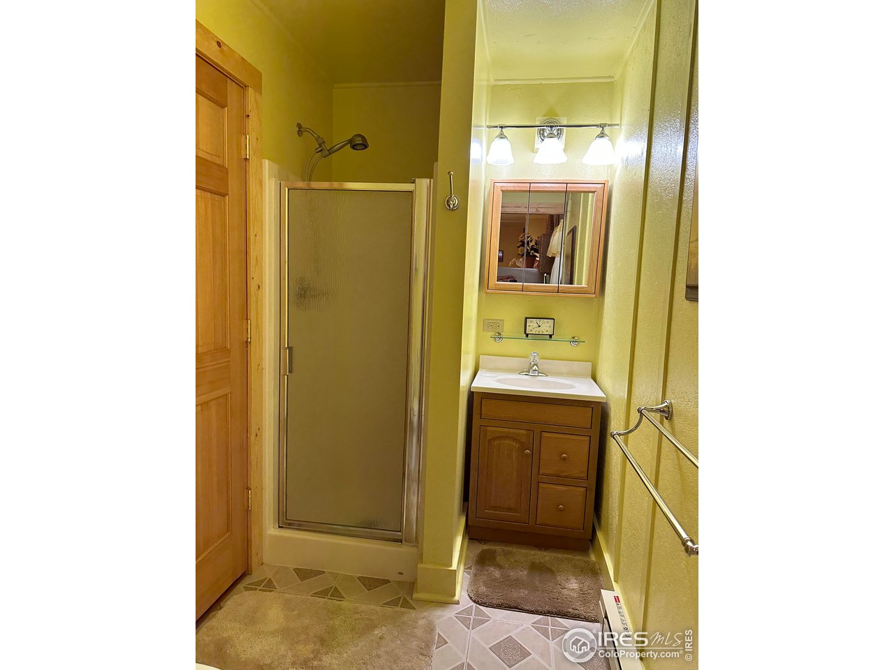 414 Riverside Drive Lyons, CO 80540 - Photo 23 of 23 a bathroom with a sink and a mirror