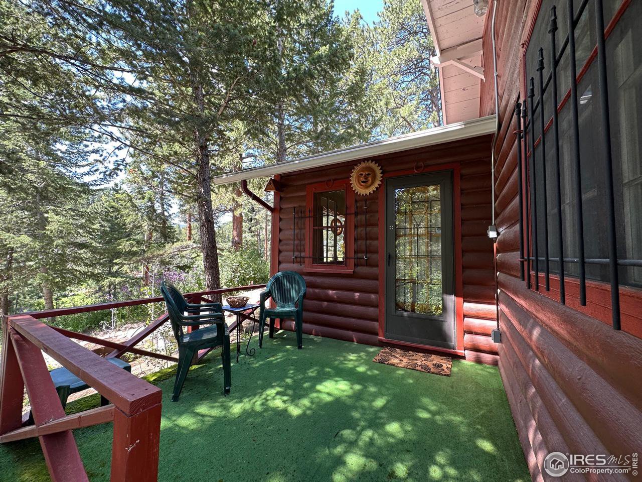 414 Riverside Drive Lyons, CO 80540 - Photo 4 of 23 a front view of a house with garden and furniture