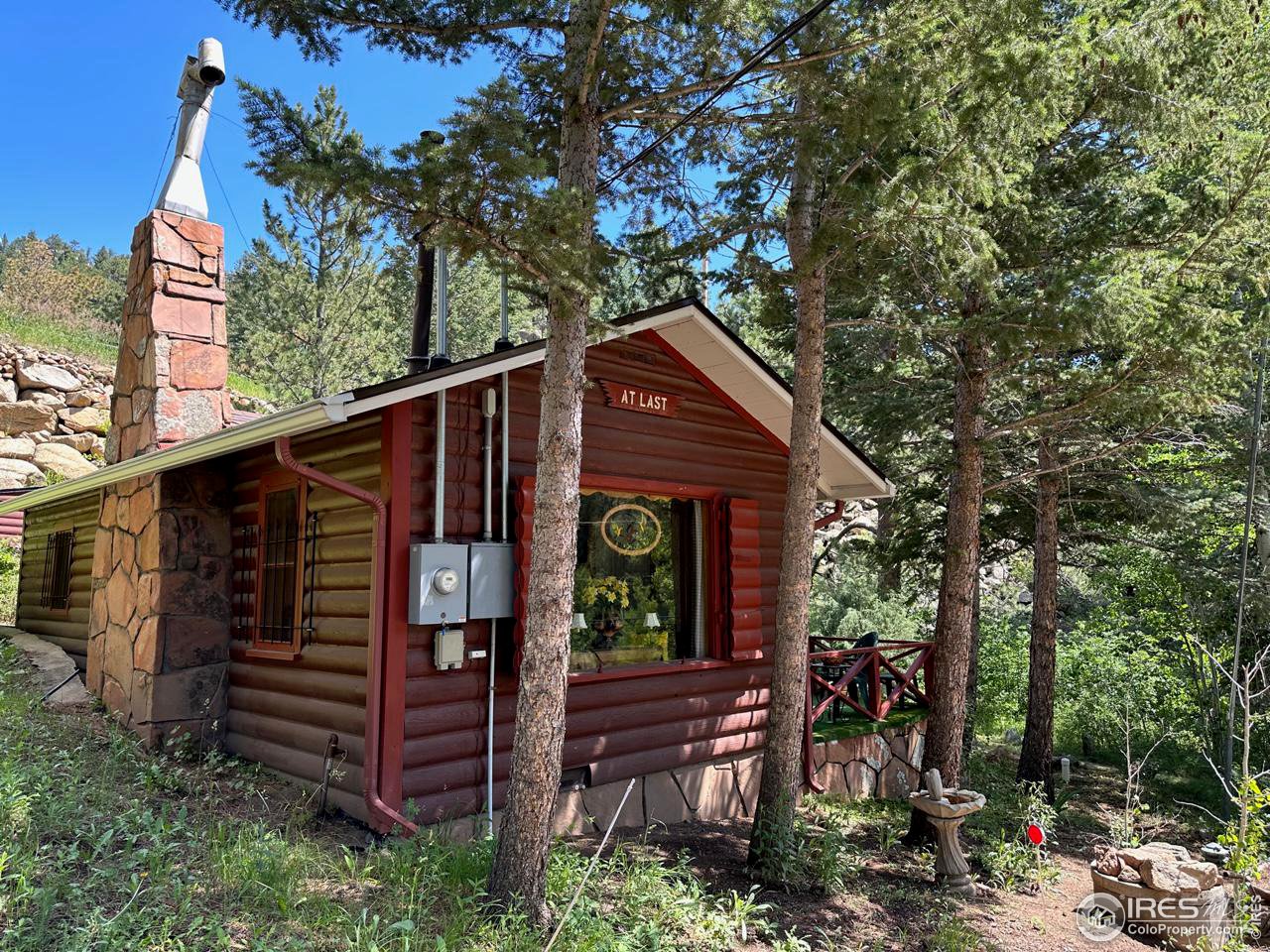 414 Riverside Drive Lyons, CO 80540 - Photo 9 of 23 a view of a house in the forest