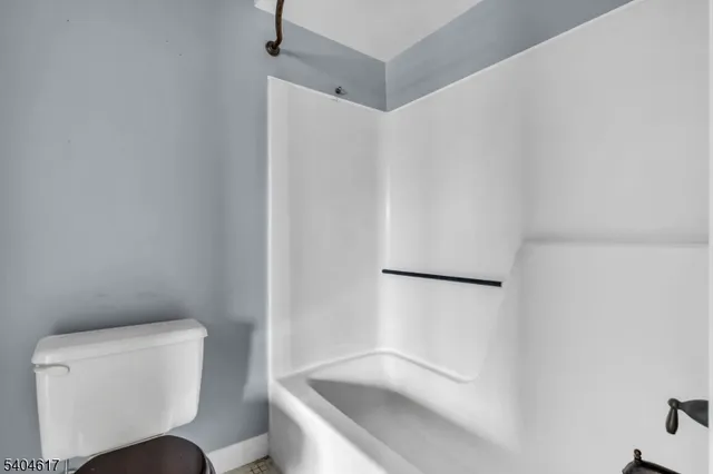 a bathroom with a toilet and a sink