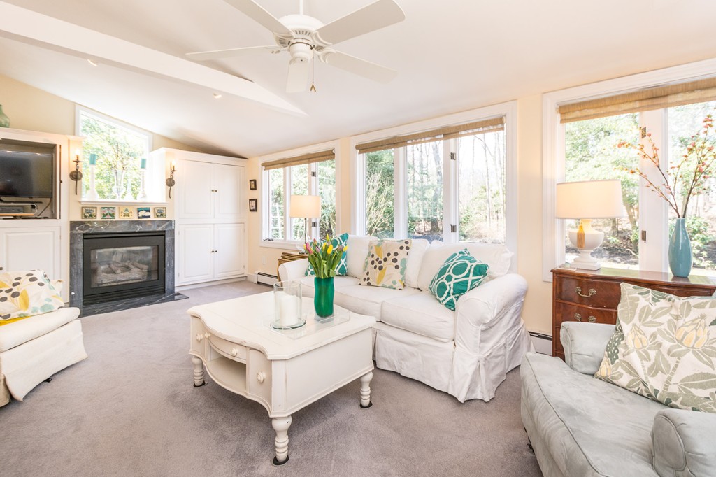 51 Deep Run Cohasset, MA 02025 - Photo 14 of 30 a living room with furniture a flat screen tv and a fireplace