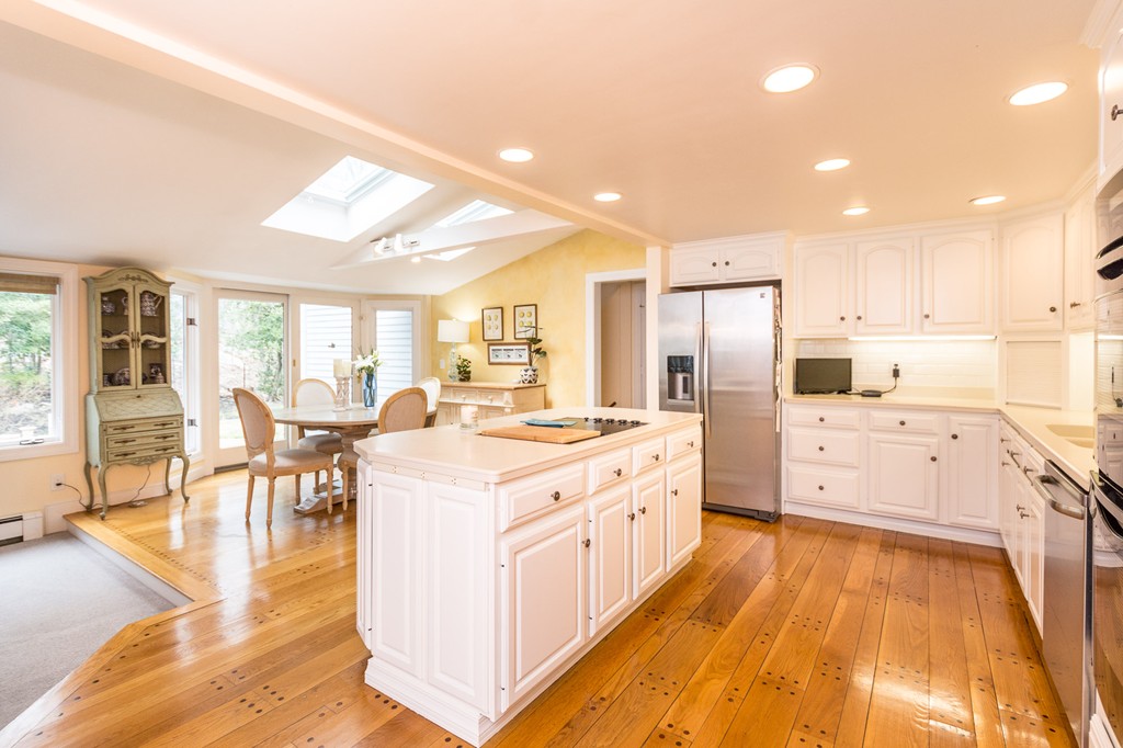 51 Deep Run Cohasset, MA 02025 - Photo 16 of 30 a large white kitchen with lots of counter top space a sink stainless steel appliances and cabinets