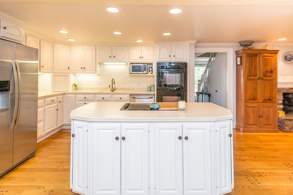 51 Deep Run Cohasset, MA 02025 - Photo 17 of 30 a kitchen with stainless steel appliances kitchen island granite countertop a refrigerator and a stove top oven