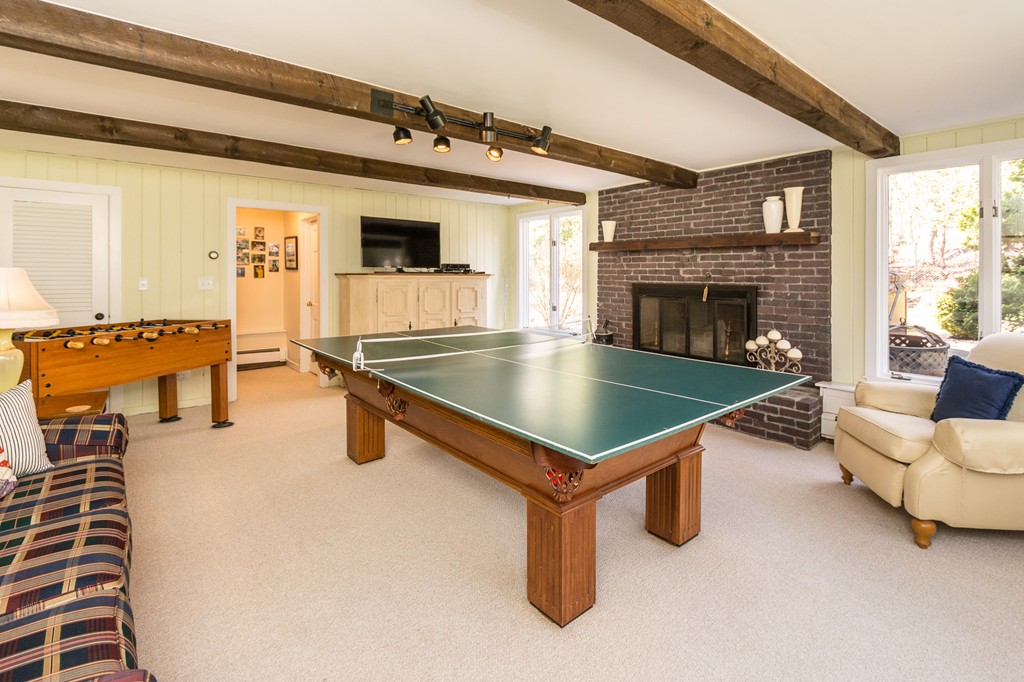 51 Deep Run Cohasset, MA 02025 - Photo 20 of 30 a living room with furniture pool table and a fireplace