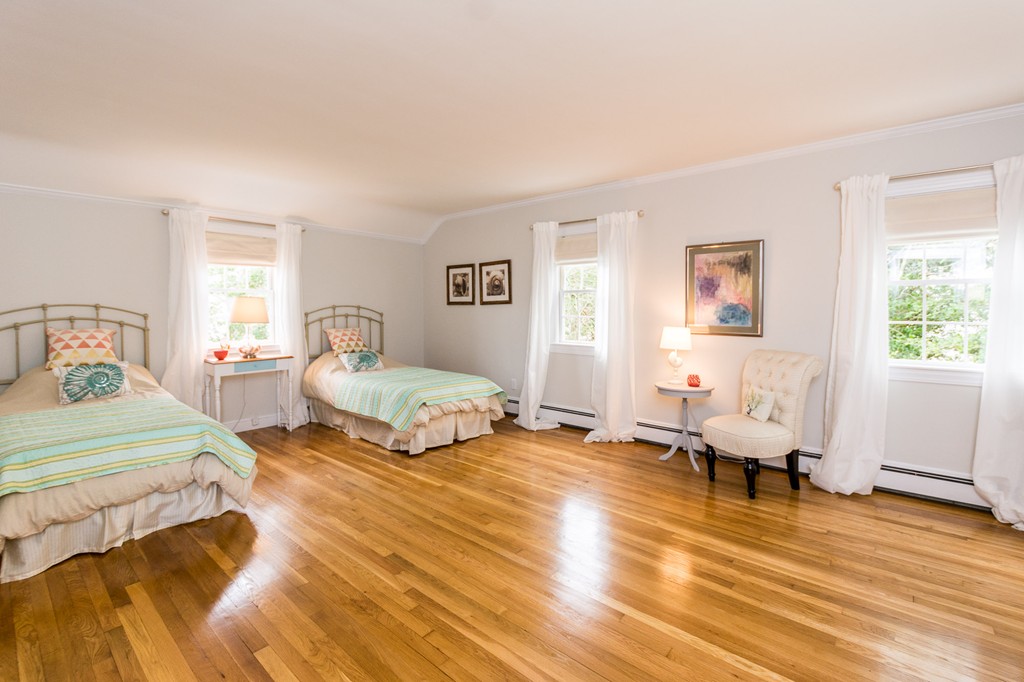 51 Deep Run Cohasset, MA 02025 - Photo 22 of 30 a bedroom with a bed and wooden floor