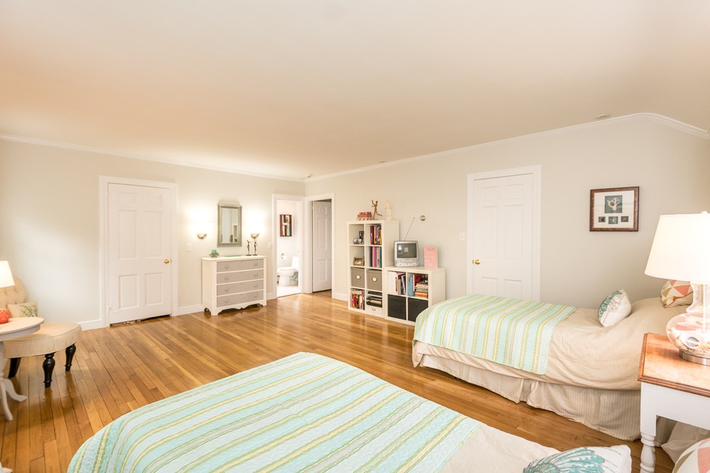 51 Deep Run Cohasset, MA 02025 - Photo 23 of 30 a bedroom with a bed and a view of living room