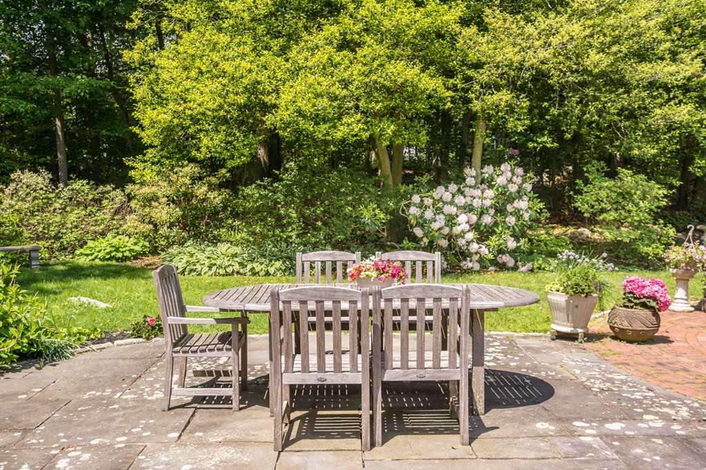 51 Deep Run Cohasset, MA 02025 - Photo 5 of 30 a table and chairs in front of a yard