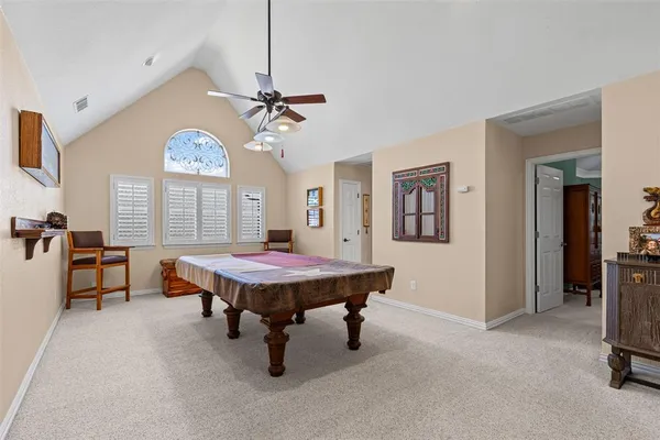 a living room with furniture a window and a chandelier