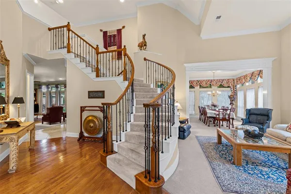 a living room with fireplace furniture and a table