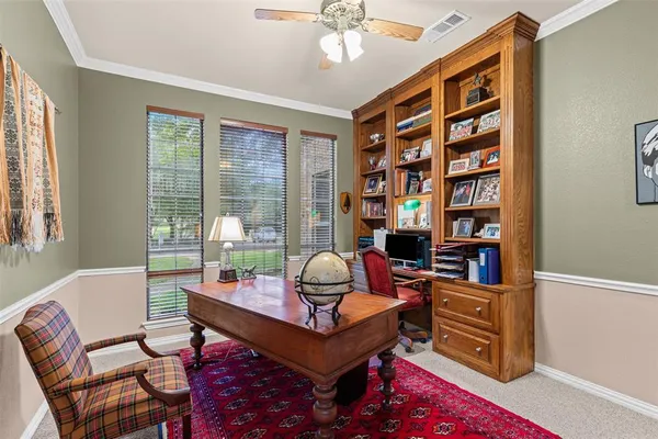 a living room with furniture cabinets and window