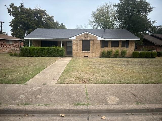 7152 Indian Ridge Trail Dallas, TX 75232 - Photo 1 of 17 front view of house with a yard