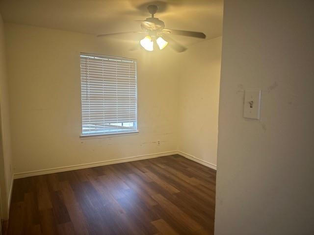 7152 Indian Ridge Trail Dallas, TX 75232 - Photo 12 of 17 a view of an empty room with wooden floor and a window