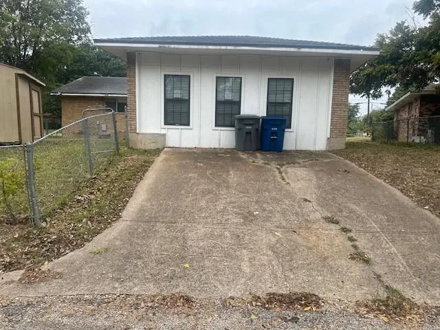 a bathroom with a shower and a sink