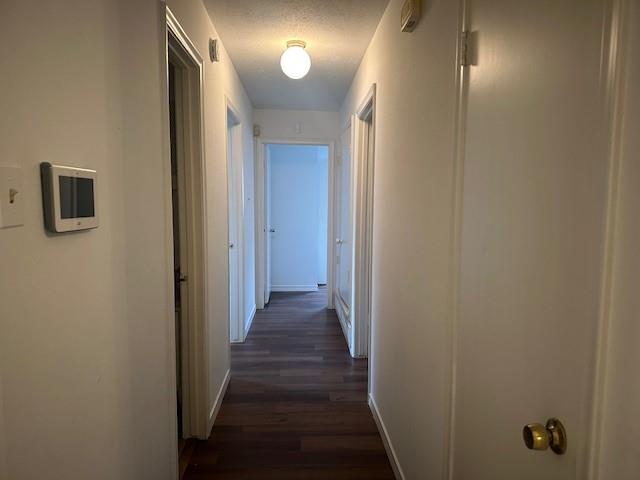 7152 Indian Ridge Trail Dallas, TX 75232 - Photo 6 of 17 a view of a hallway with wooden floor
