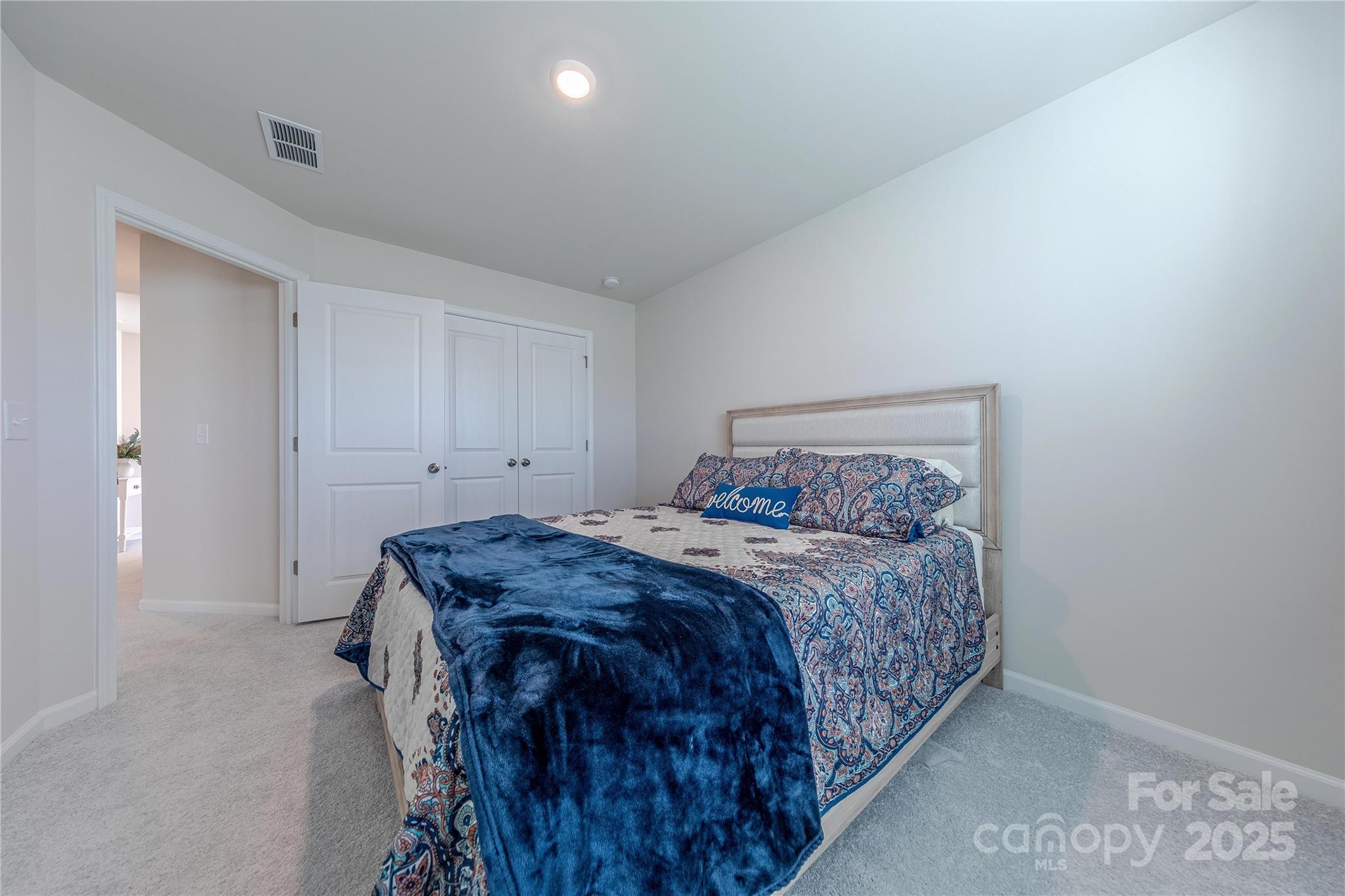 8007 Scarlet Maple Lane Tega Cay, SC 29708 - Photo 20 of 24 a bedroom with a bed and a window