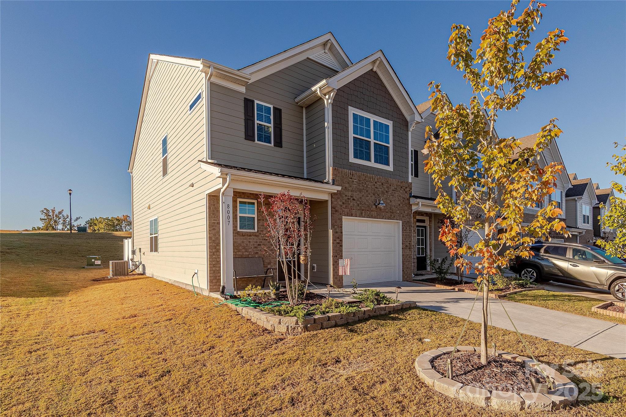 8007 Scarlet Maple Lane Tega Cay, SC 29708 - Photo 2 of 24 a front view of a house with a yard