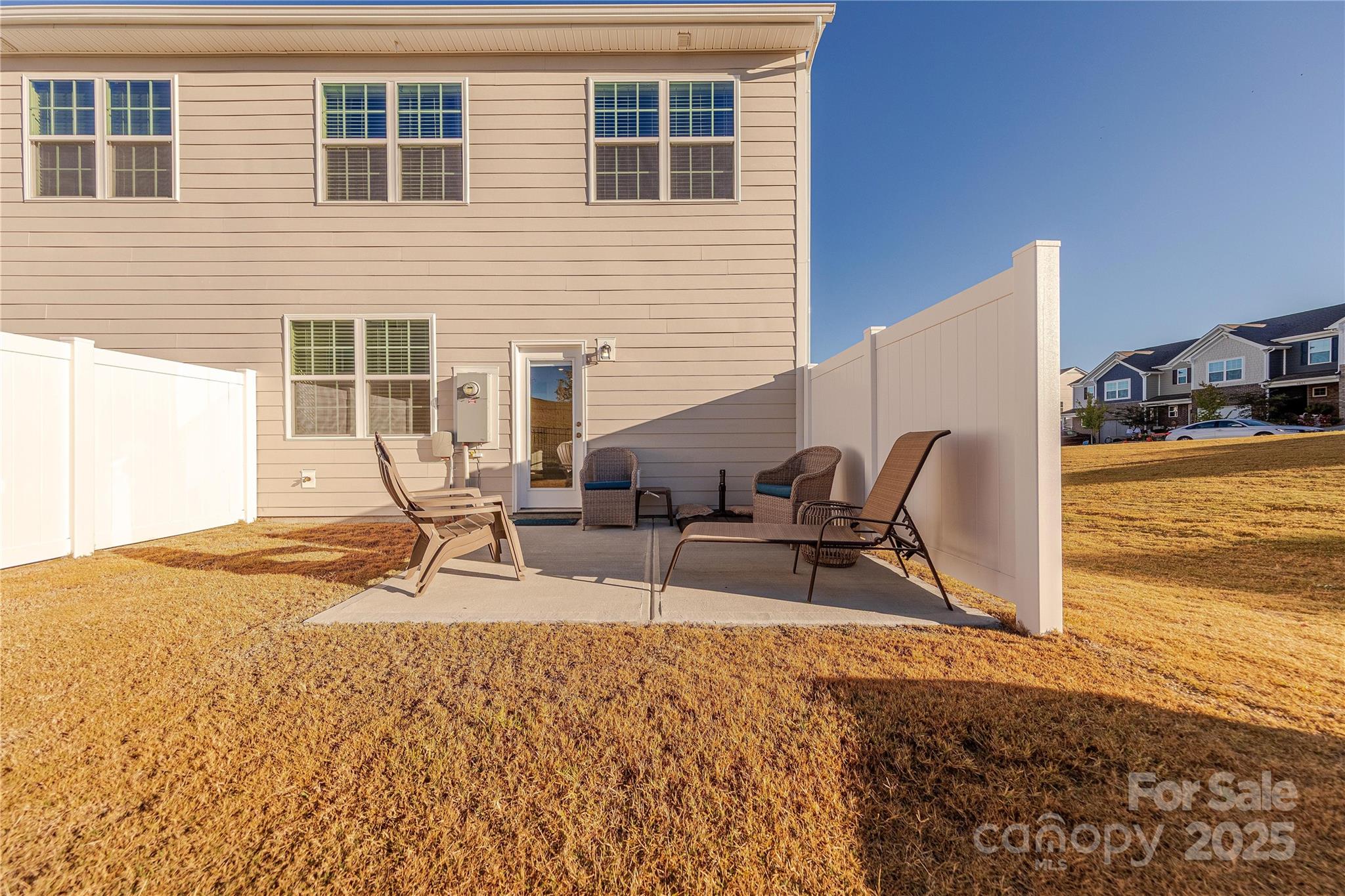 8007 Scarlet Maple Lane Tega Cay, SC 29708 - Photo 23 of 24 a view of a house with backyard and sitting area