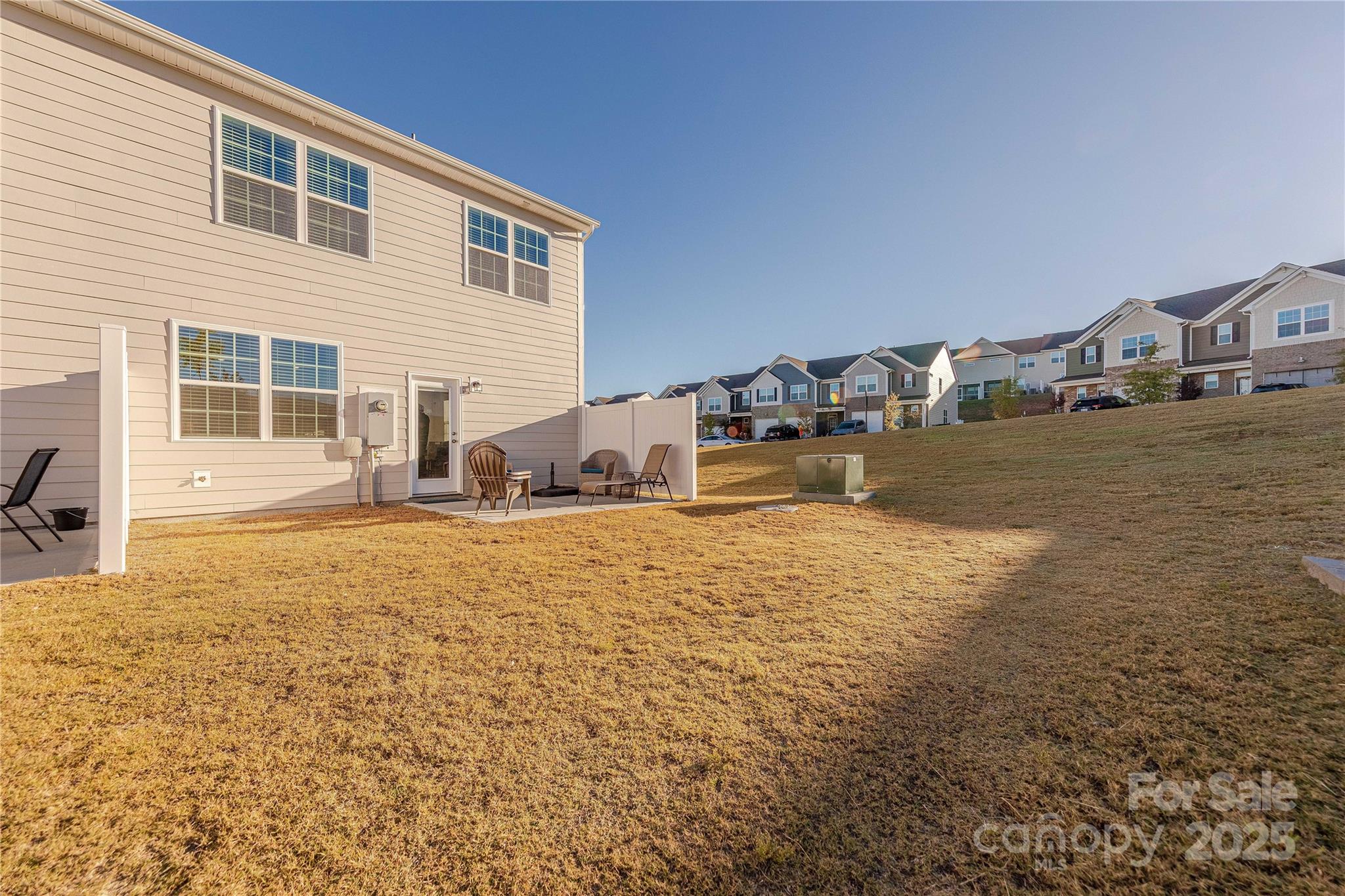 8007 Scarlet Maple Lane Tega Cay, SC 29708 - Photo 24 of 24 a view of a house with backyard and porch