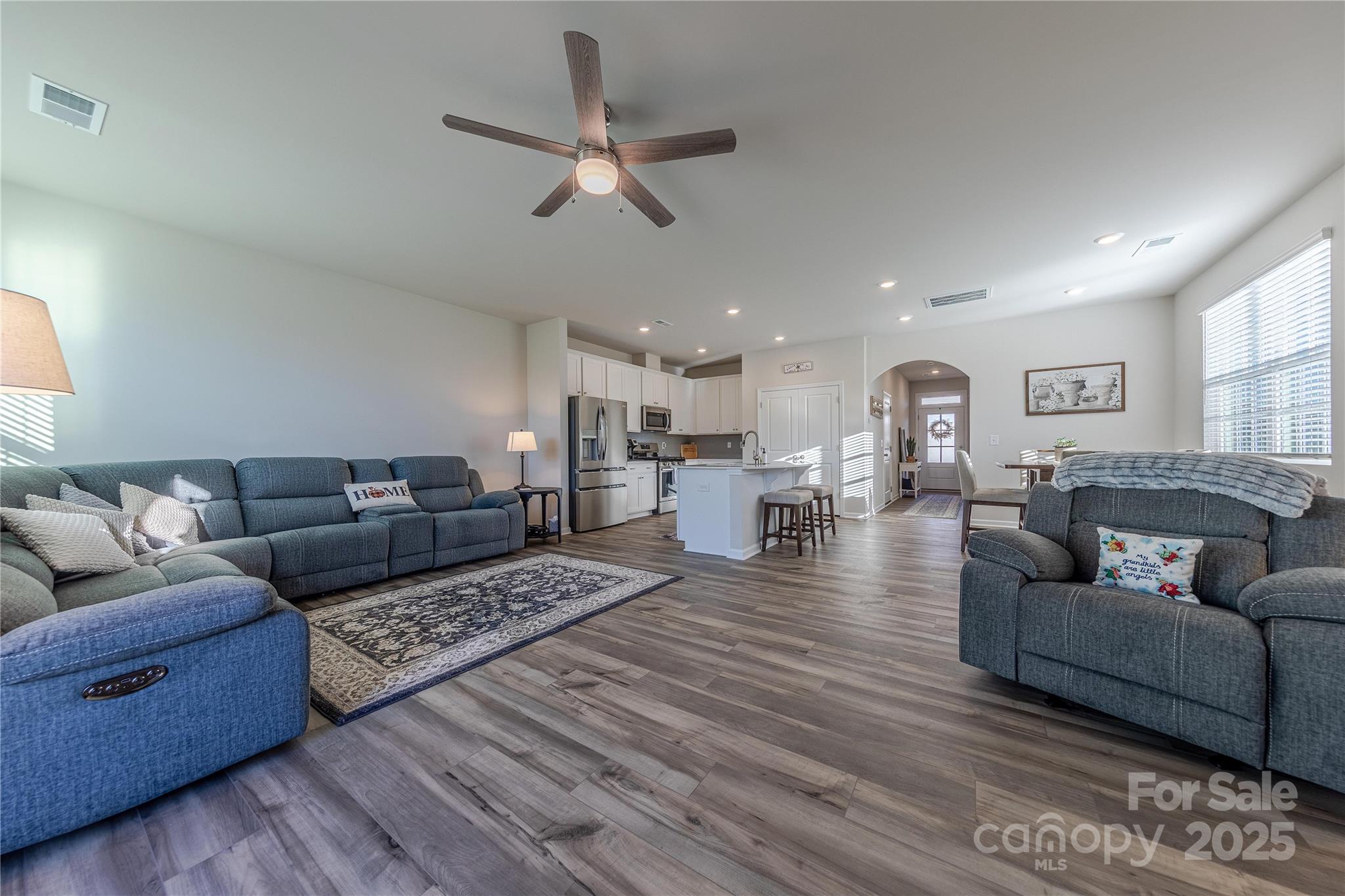 8007 Scarlet Maple Lane Tega Cay, SC 29708 - Photo 5 of 24 a living room with furniture and a view of kitchen