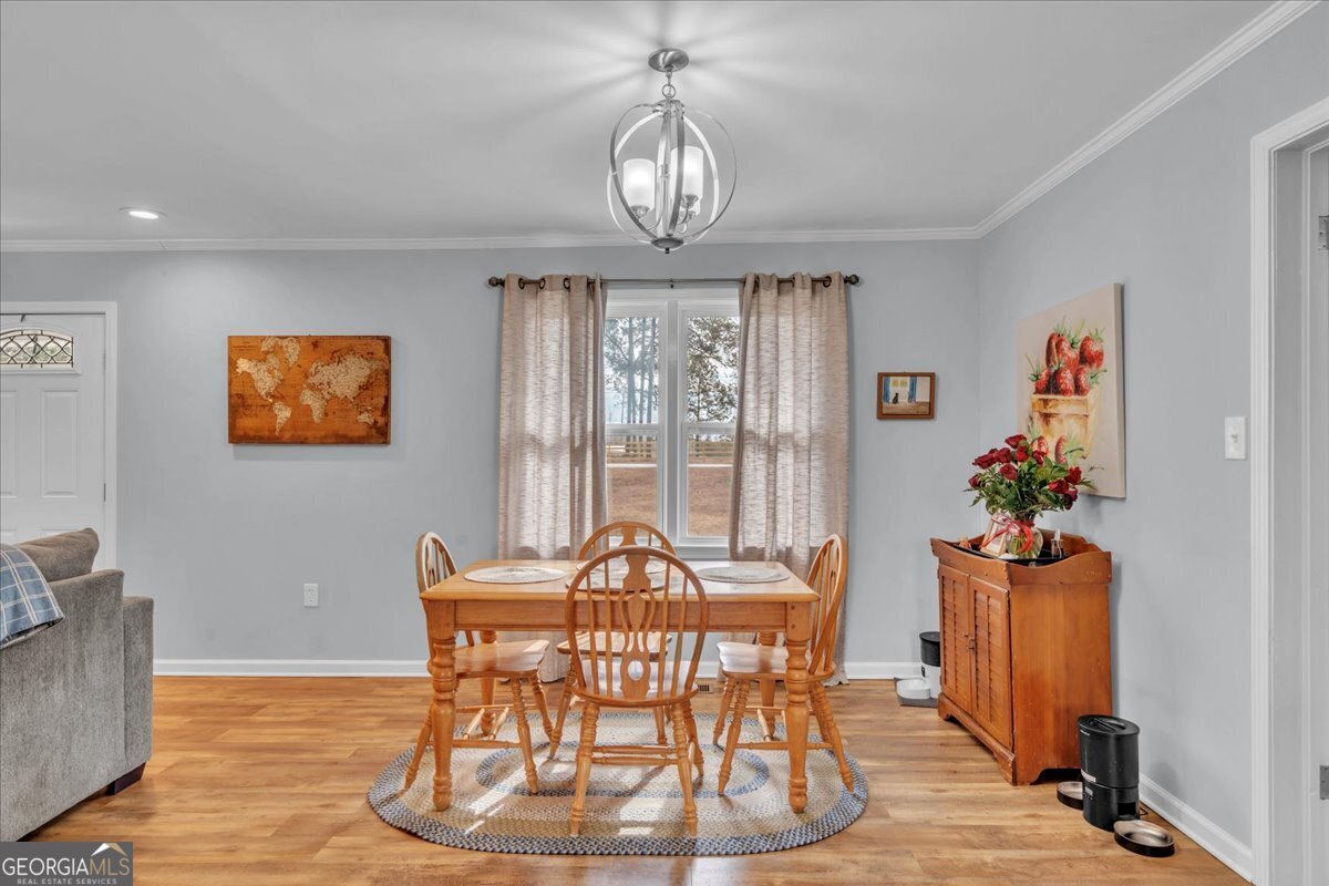 480 Country Club Road Dublin, GA 31021 - Photo 15 of 42 a view of a dining room with furniture window and outside view