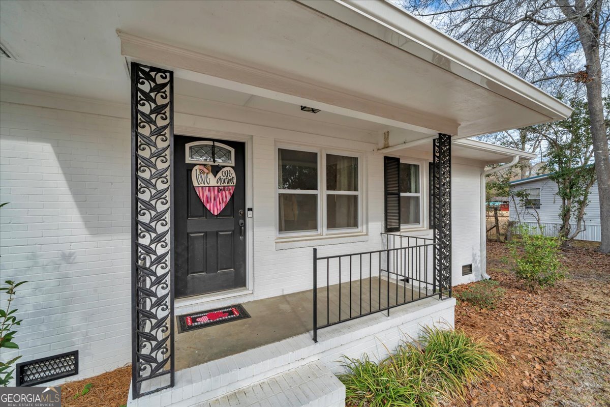 480 Country Club Road Dublin, GA 31021 - Photo 2 of 42 a front view of a house with entryway