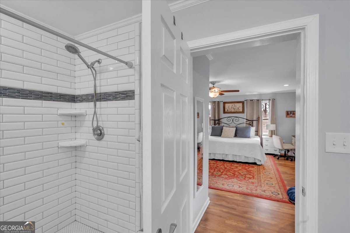 480 Country Club Road Dublin, GA 31021 - Photo 23 of 42 a view of a walk in closet and bathroom