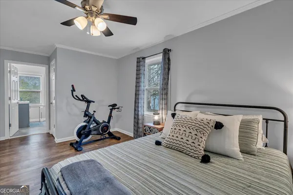 a bedroom with furniture and a window