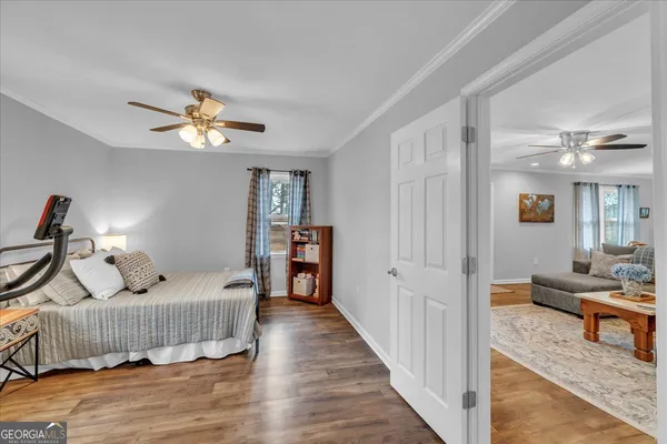 a bedroom with furniture and a window