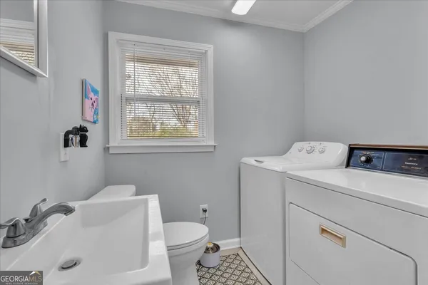 a utility room with dryer and washer