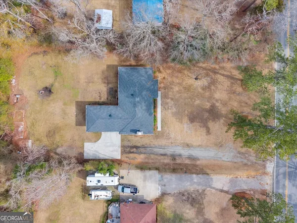 a aerial view of a house with a yard