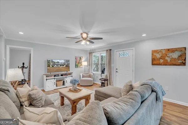 a living room with furniture and a flat screen tv