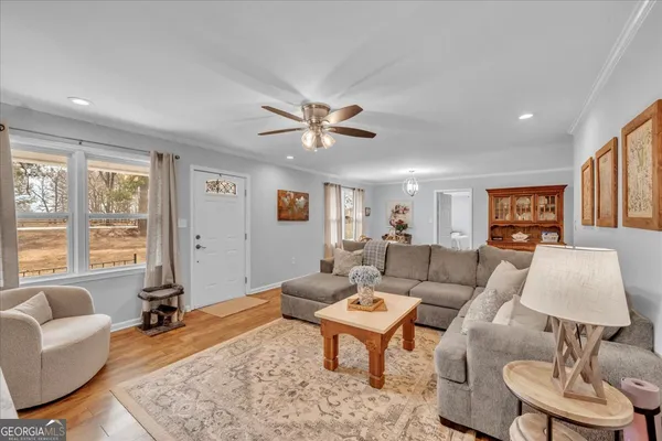 a living room with furniture and a window