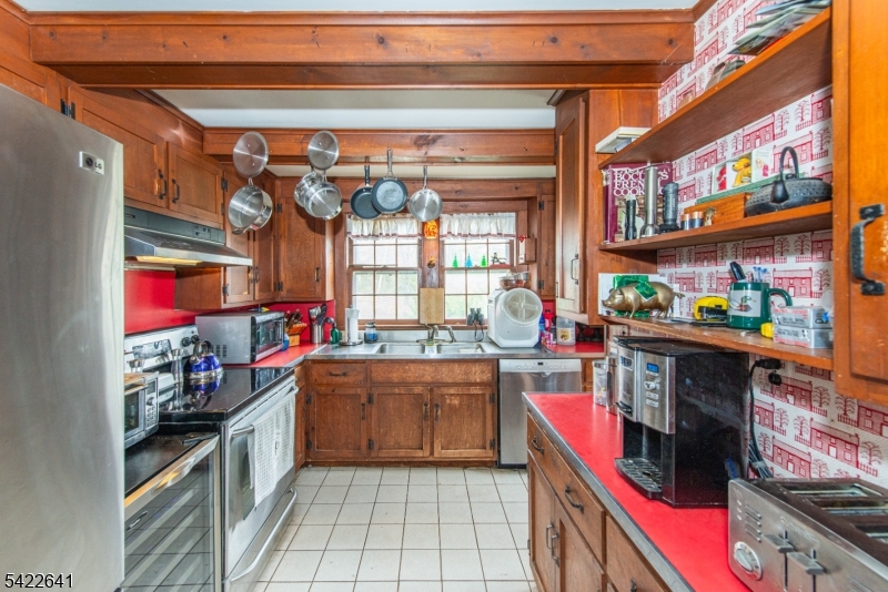 570 Mine Brook Road Bernardsville, NJ 07924 - Photo 17 of 38 a kitchen with stainless steel appliances granite countertop a sink and cabinets