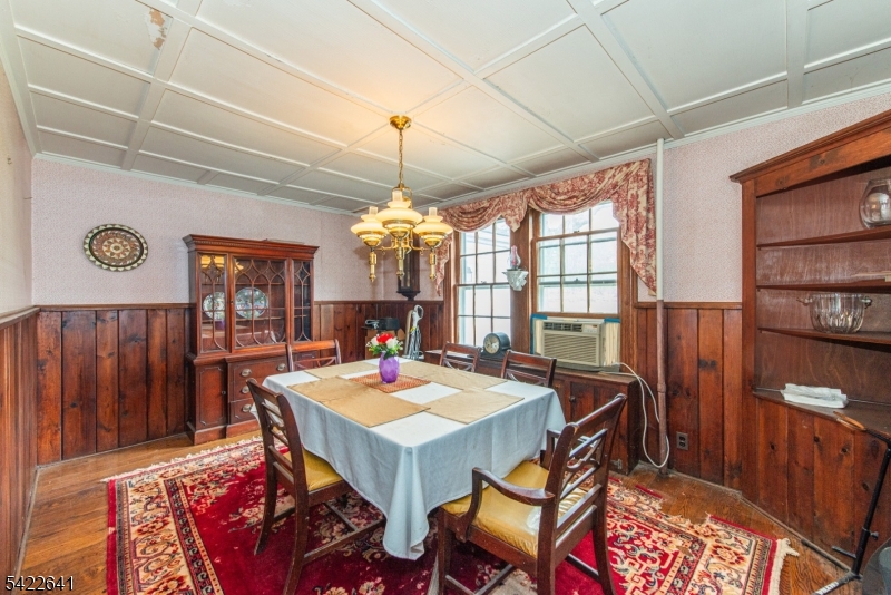 570 Mine Brook Road Bernardsville, NJ 07924 - Photo 18 of 38 a view of a dining room with furniture window and wooden floor