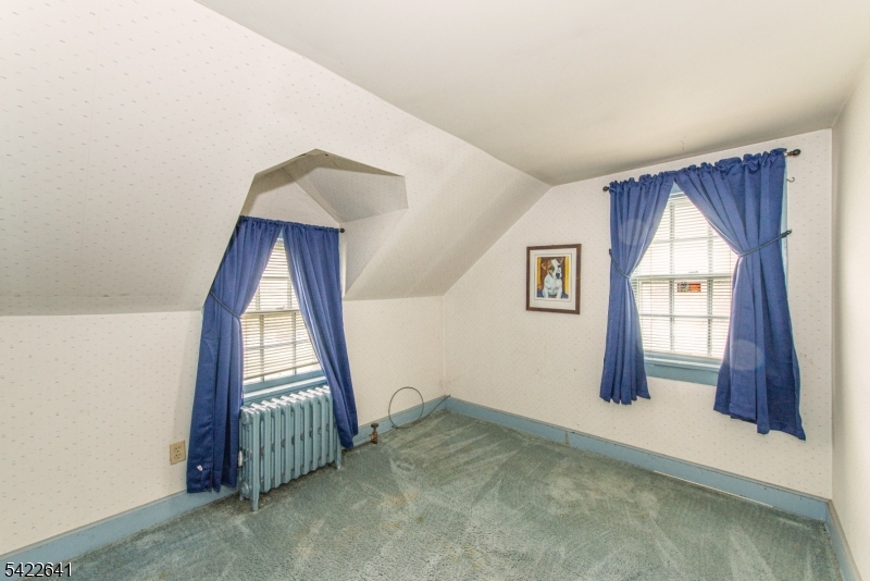 570 Mine Brook Road Bernardsville, NJ 07924 - Photo 22 of 38 a view of a livingroom with wooden floor and a window