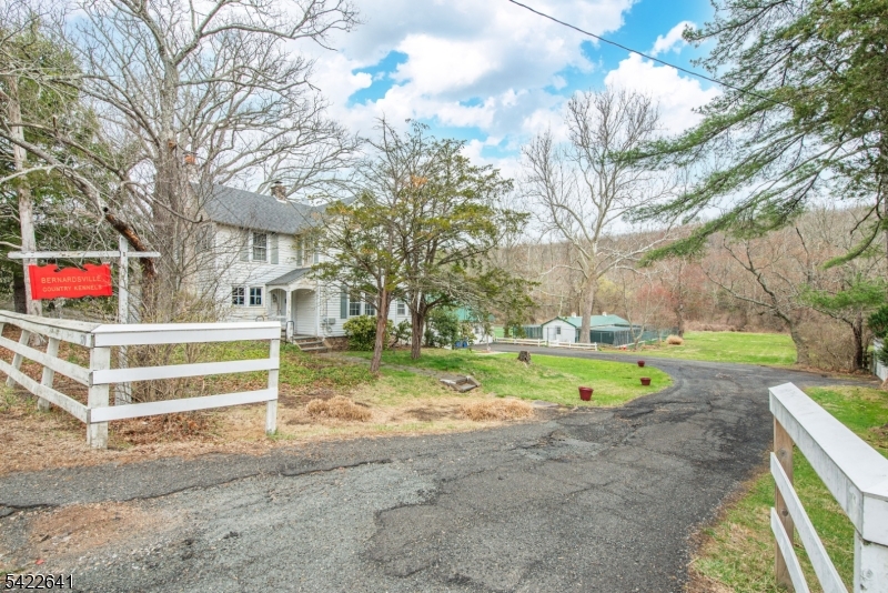 570 Mine Brook Road Bernardsville, NJ 07924 - Photo 6 of 38 a view of a backyard with a garden and trees