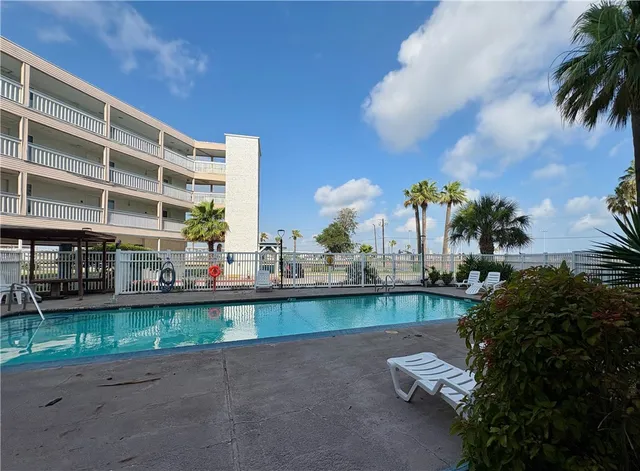 a view of a chairs and table in patio