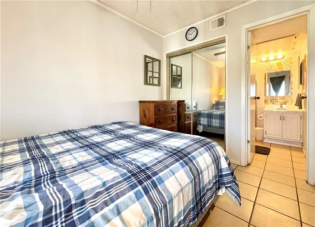 a bedroom with a bed and a stove top oven