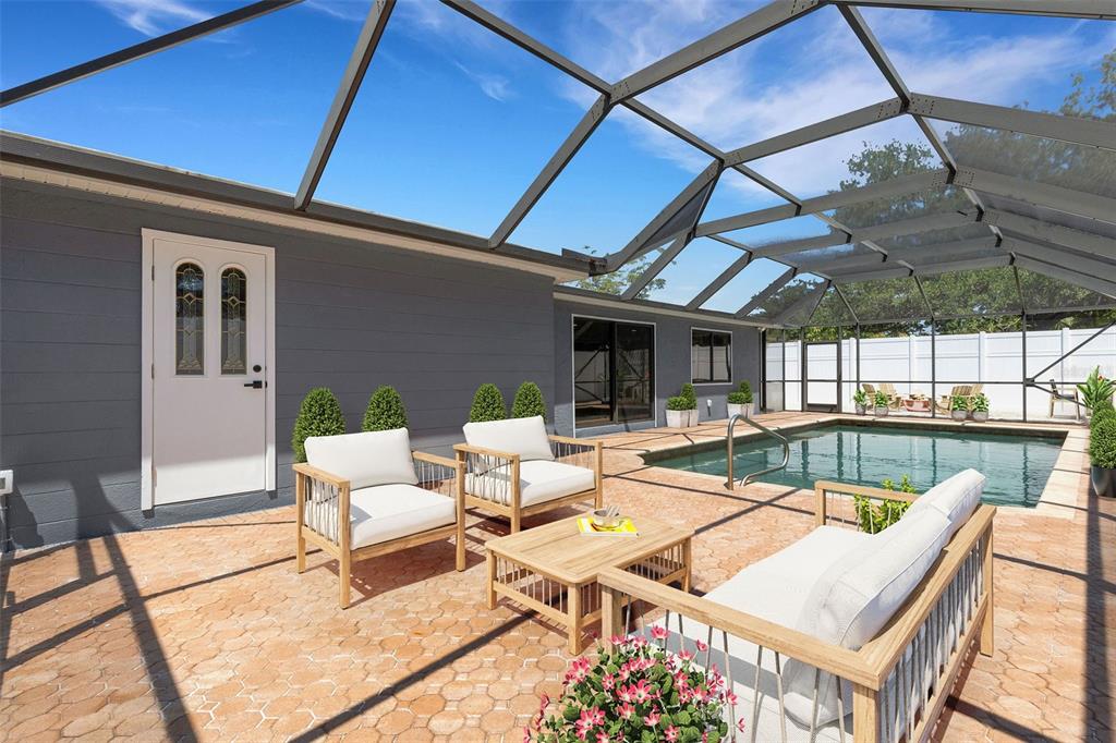 4645 Hunter Ridge Drive Sarasota, FL 34233 - Photo 13 of 70 a view of a patio with swimming pool