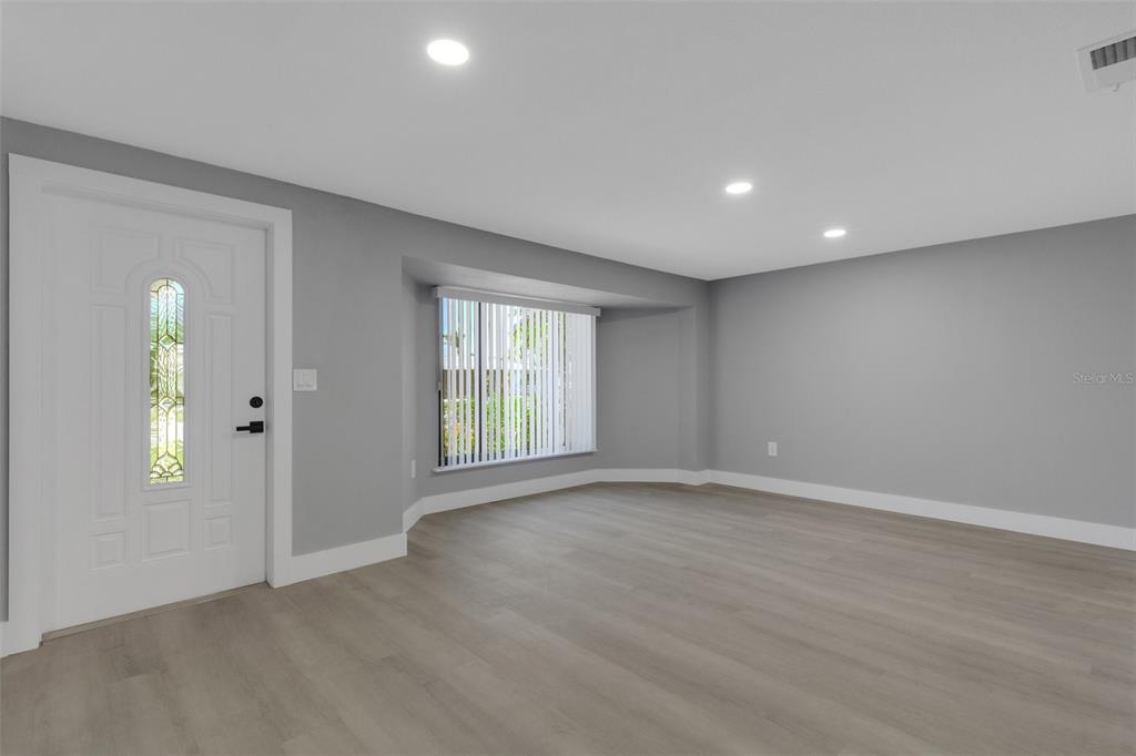 4645 Hunter Ridge Drive Sarasota, FL 34233 - Photo 14 of 70 a view of an empty room with a window