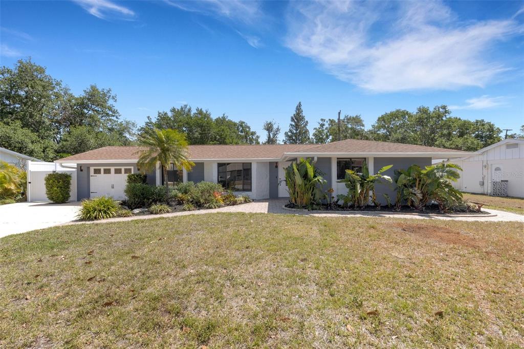 4645 Hunter Ridge Drive Sarasota, FL 34233 - Photo 2 of 70 front view of a house with a patio